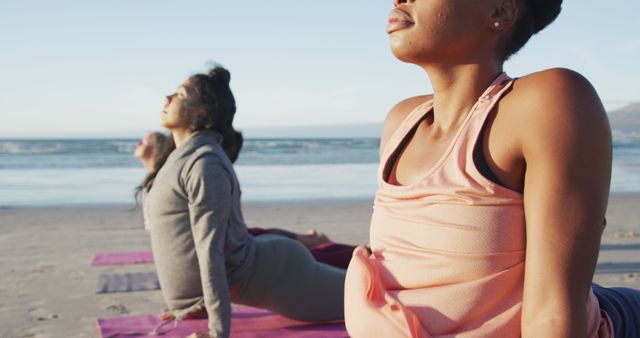 Group of diverse female friends practicing yoga, stretching at the beach - Download Free Stock Photos Pikwizard.com