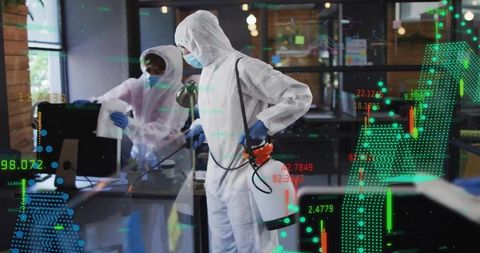 Hazmat team disinfecting office with electrostatic sprayer and data analytics overlay