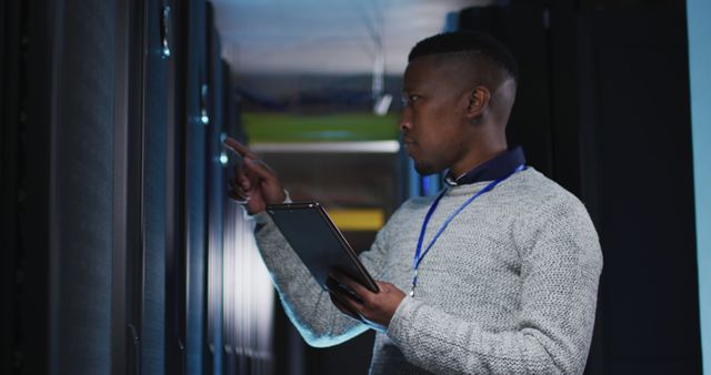 African american male computer technician using tablet working in business server room - Download Free Stock Photos Pikwizard.com