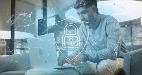 Professional worker on laptop with cybersecurity lock icon overlay