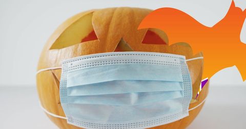 Pumpkin Decorated with Face Mask for Halloween Celebration