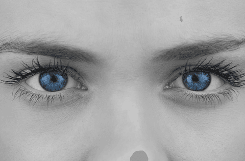 Enhancing contrast between blue eyes and grey tone face, this close-up emphasizes inner beauty and emotional depth. Useful for eye care adverts, photography showcases, and discussions on natural beauty. Ideal for social media posts promoting wellness, individuality, or artistic campaigns highlighting eye-catching features.