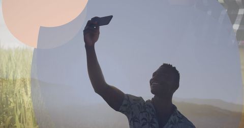 Joyful Man in Stylish Shirt Taking a Selfie Outdoors
