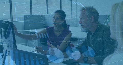 Business Professionals Analyzing Digital Data in Modern Office Setting