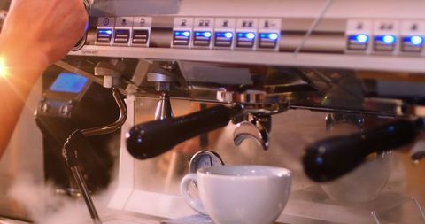 Barista Using Espresso Machine in Cafe, Creating Fresh Coffee