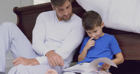 Father and Son Enjoying Storytime Together at Home