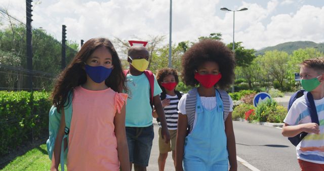 Diverse Group of Kids Wearing Masks Walking Along the Street - Download Free Stock Images Pikwizard.com