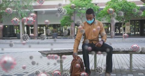 Man Watching Socially Distanced, Conveying COVID-19 Awareness