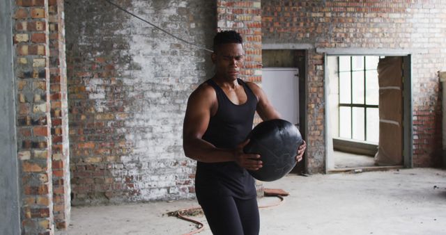 Focused Athlete Training Indoors Holding Medicine Ball Performing Exercises - Download Free Stock Images Pikwizard.com