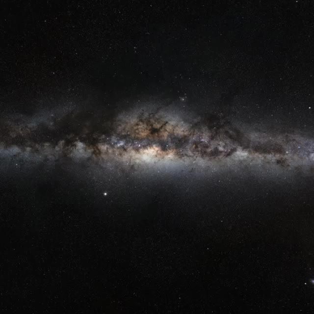 This image showcases a breathtaking panoramic view of the Milky Way galaxy under a dark, star-filled sky. The clear and vibrant depiction of the galaxy is ideal for educational materials, space exploration promotions, science fiction media, and as a decorative piece that inspires wonder and curiosity about the universe.