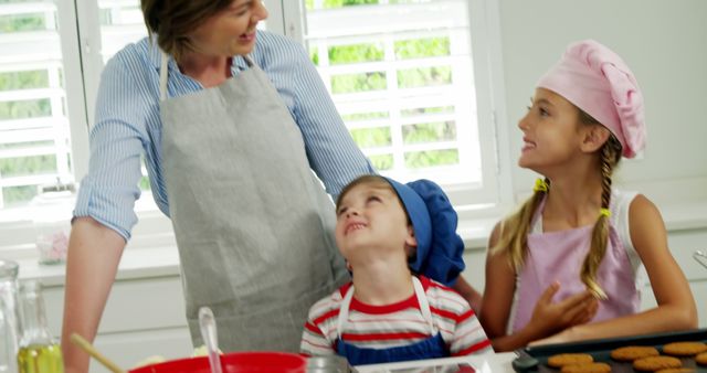 Happy Family Baking Together in Bright Kitchen - Download Free Stock Images Pikwizard.com