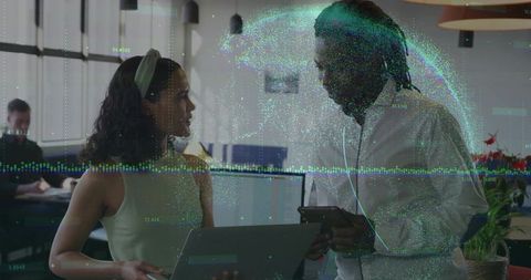 Office professionals collaborating on digital data project