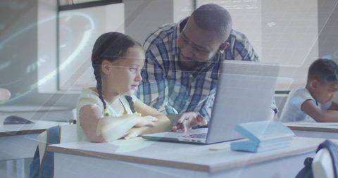 Teacher Guiding Student on Laptop in Classroom, Personalized Digital Learning Support