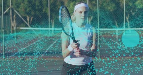 Female tennis player holding racket on court with turquoise particle motion overlay, energetic