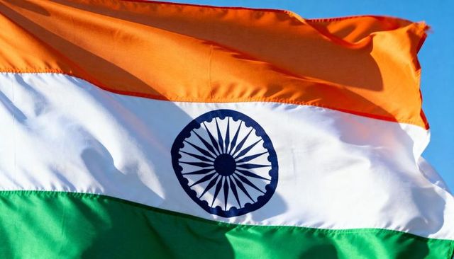 Waving indian flag tricolor featuring saffron white green bands and ashoka chakra