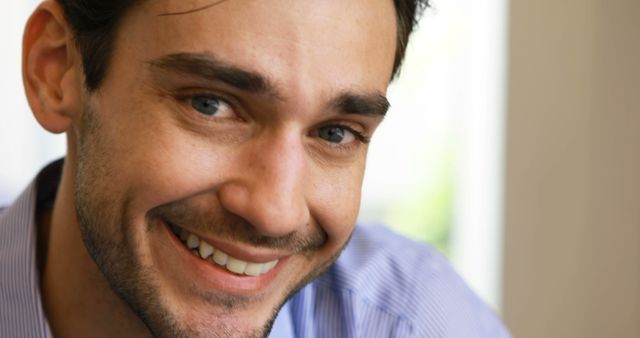 Close-up of Smiling Young Man with Beard and Blue Shirt - Download Free Stock Images Pikwizard.com