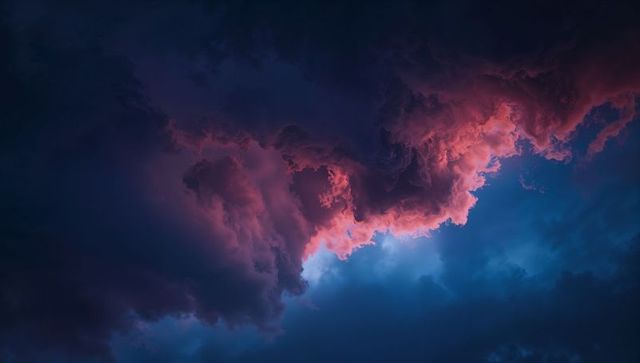 Dramatic dusk clouds with pink and red illumination