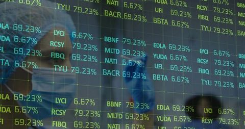 Medical Team Analyzing Data with Digital Overlay in Surgical Room