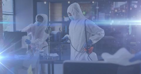 Healthcare workers disinfecting office space amid pandemic