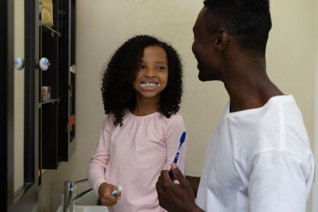 Father and Daughter Brushing Teeth Together - Download Free Stock Images Pikwizard.com