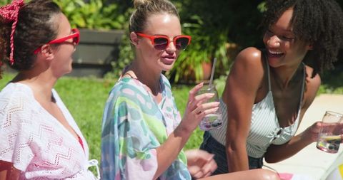 Diverse Friends at Poolside Enjoying Summer Drinks and Fun