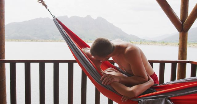 Couple Relaxing in Hammock by Serene Lake - Download Free Stock Images Pikwizard.com