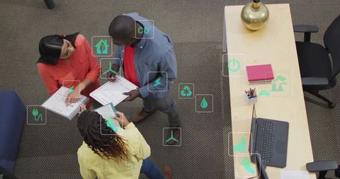 Diverse Team Discussing Sustainability in Modern Office Environment