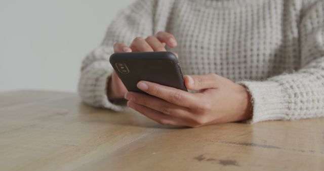 Person Using Smartphone at Wooden Table - Download Free Stock Images Pikwizard.com