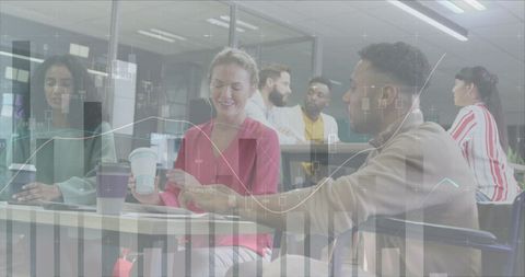 Diverse Business Team Analyzing Financial Data in Bright Office