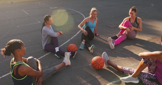 Diverse female basketball team wearing sportswear, stretching - Download Free Stock Photos Pikwizard.com