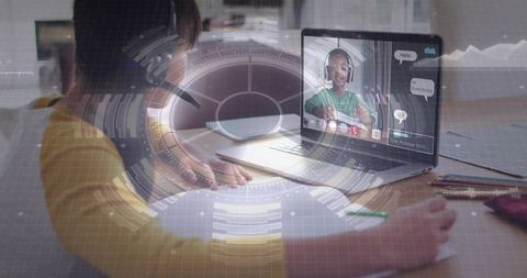 Child studying remotely with futuristic hud overlay and online video tutor on laptop