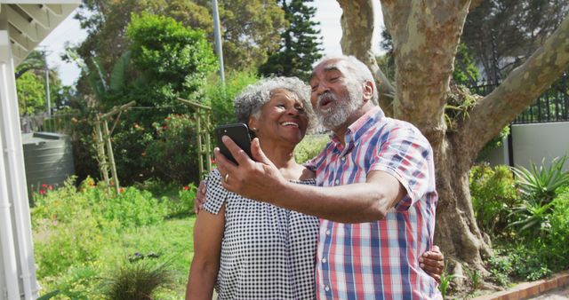 Senior couple enjoying their time together outdoors, capturing a joyful moment. Perfect for advertisements, healthcare brochures, retirement community promotions, and lifestyle blogs discussing active senior living.