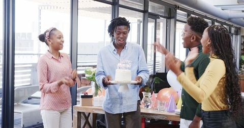 Colleagues Celebrating Birthday in Office Environment