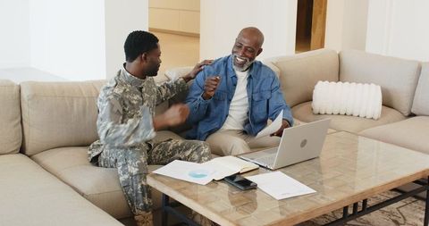 Father and Soldier Son Celebrating Success at Home