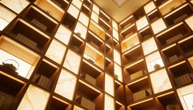 Backlit marble and wooden grid shelving showcasing teapots and decorative boxes