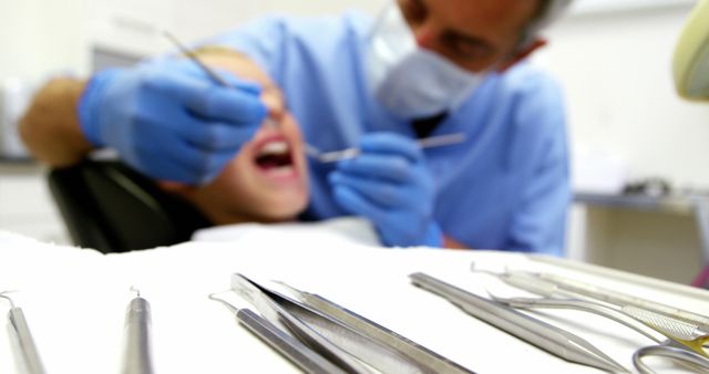 Dentist Treating Young Patient in Dental Clinic - Download Free Stock Images Pikwizard.com