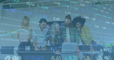 Diverse Team Analyzing Stock Market Data Together In Office