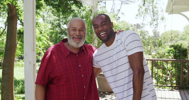 Portrait of happy diverse adult son and senior father embracing on sunny porch and smiling - Download Free Stock Photos Pikwizard.com