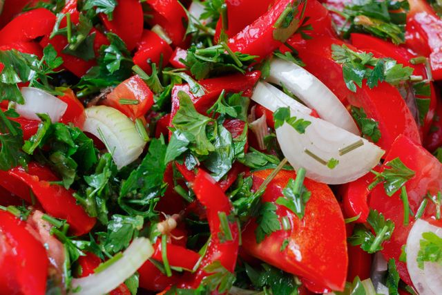 Fresh Vegetable Salad with Red Bell Peppers, Onions, and Parsley - Download Free Stock Photos Pikwizard.com