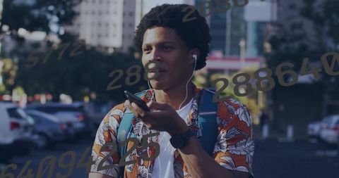 Urban Man Communicating via Smartphone on City Street