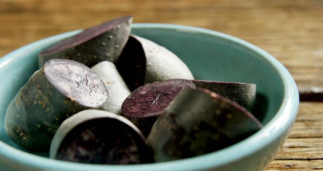 Sliced Traditional Blood Sausage in a Blue Bowl on Wooden Table - Download Free Stock Images Pikwizard.com