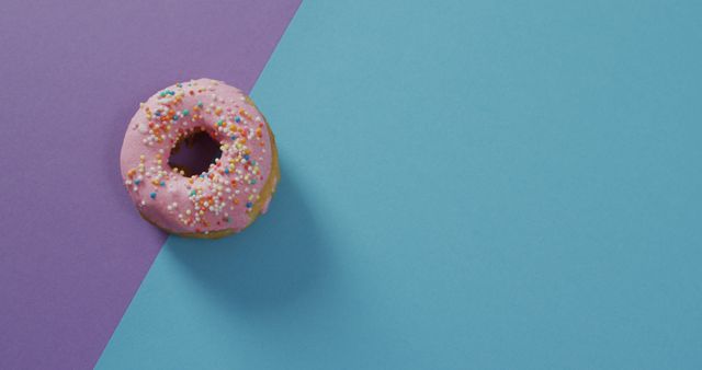 Pink Sprinkled Donut On Bright Bi-Color Background - Download Free Stock Images Pikwizard.com