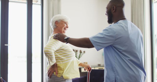 Elderly woman receiving physical therapy at home with caregiver's support - Download Free Stock Images Pikwizard.com