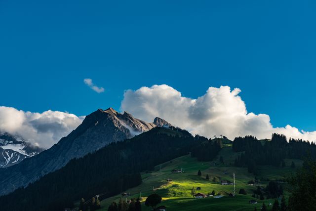 Serene Mountain Landscape with Cloudy Sky and Lush Green Fields - Download Free Stock Photos Pikwizard.com