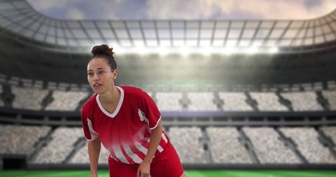 Female Soccer Player in Action on Stadium Field