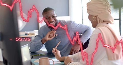 Business Analysts Reviewing Financial Data on Monitor