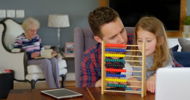 Father Teaching Daughter with Abacus at Home - Download Free Stock Images Pikwizard.com