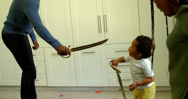 Family Bonding Activity Using Toy Swords in Modern Home - Download Free Stock Images Pikwizard.com