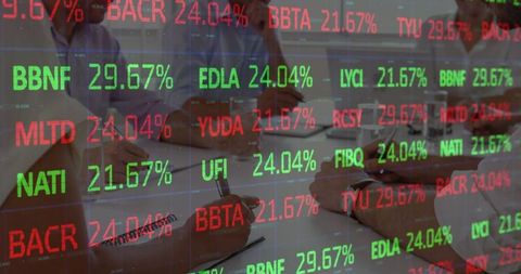 Business Team Analyzing Data With Stock Market Overlay