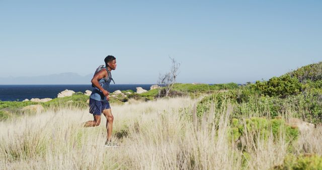 Man Running Through Wilderness on Sunny Day - Download Free Stock Images Pikwizard.com